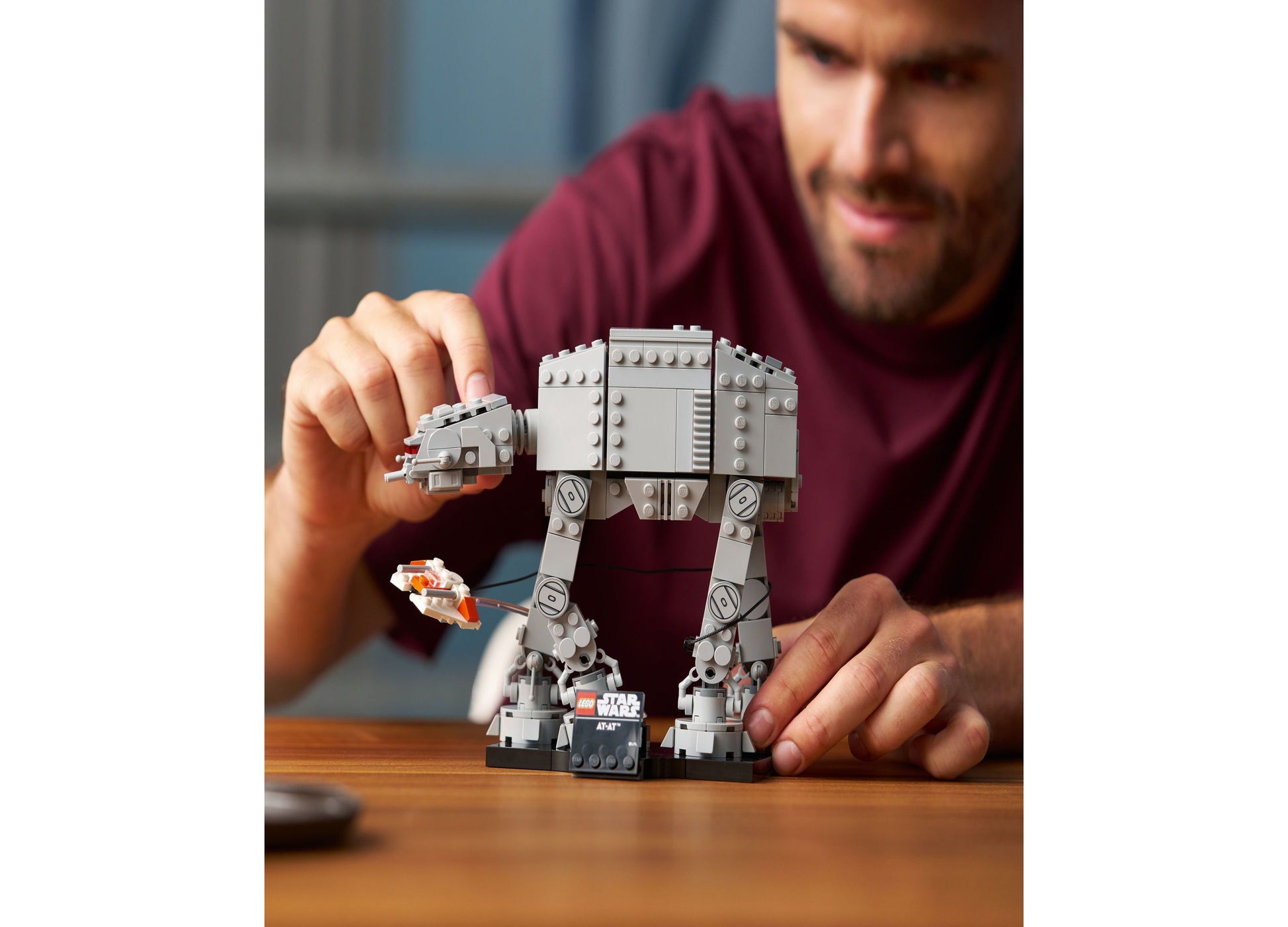 LEGO Star Wars AT-AT Walker Building Set 75440 with 525 pieces being assembled by adult hands