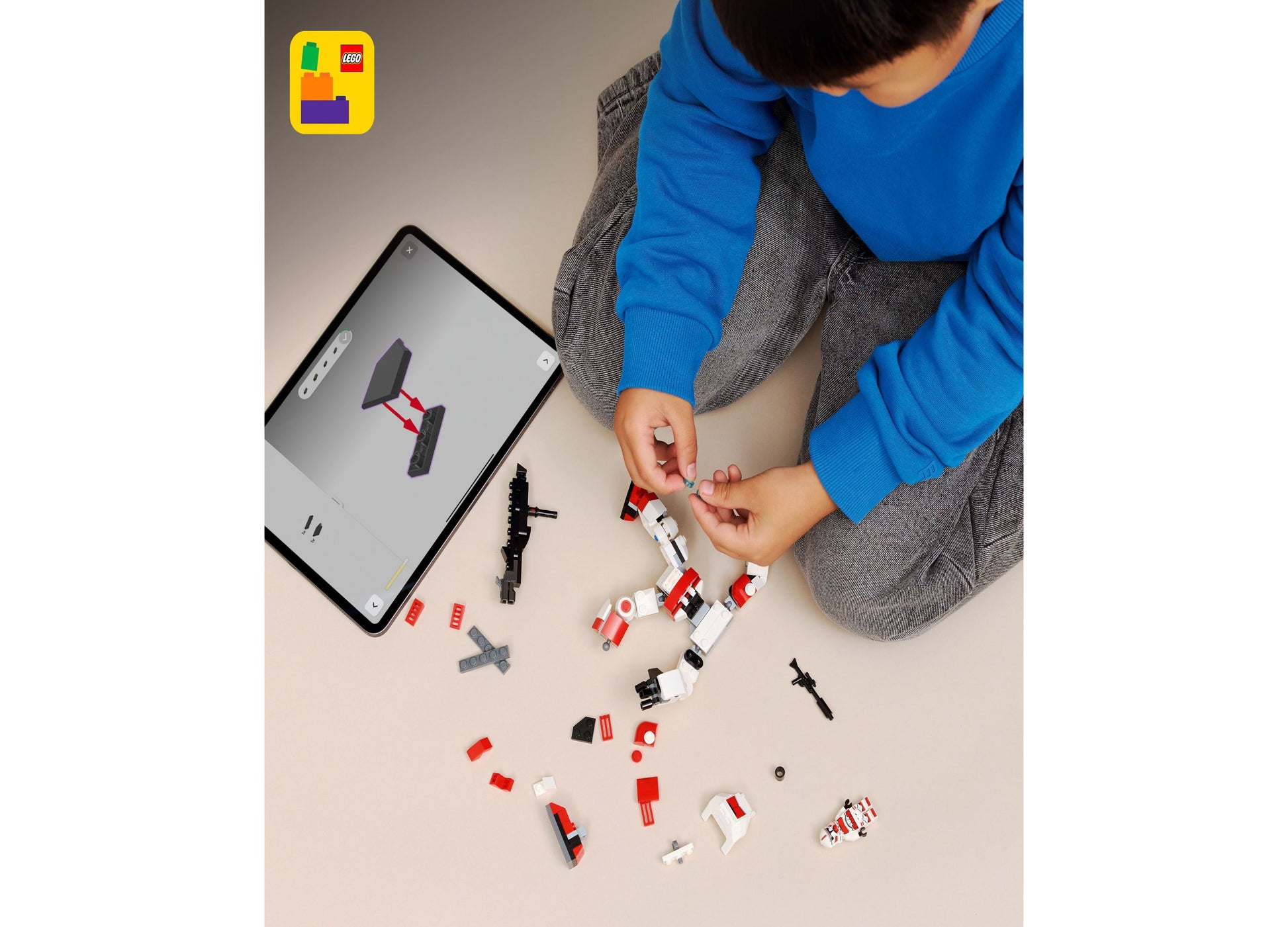 LEGO Star Wars Clone Shock Trooper Mech 75448 being built by child with red and white pieces