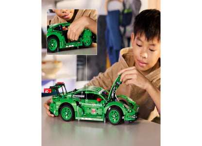 LEGO Technic Porsche 911 GT3 R green racing car being assembled by child