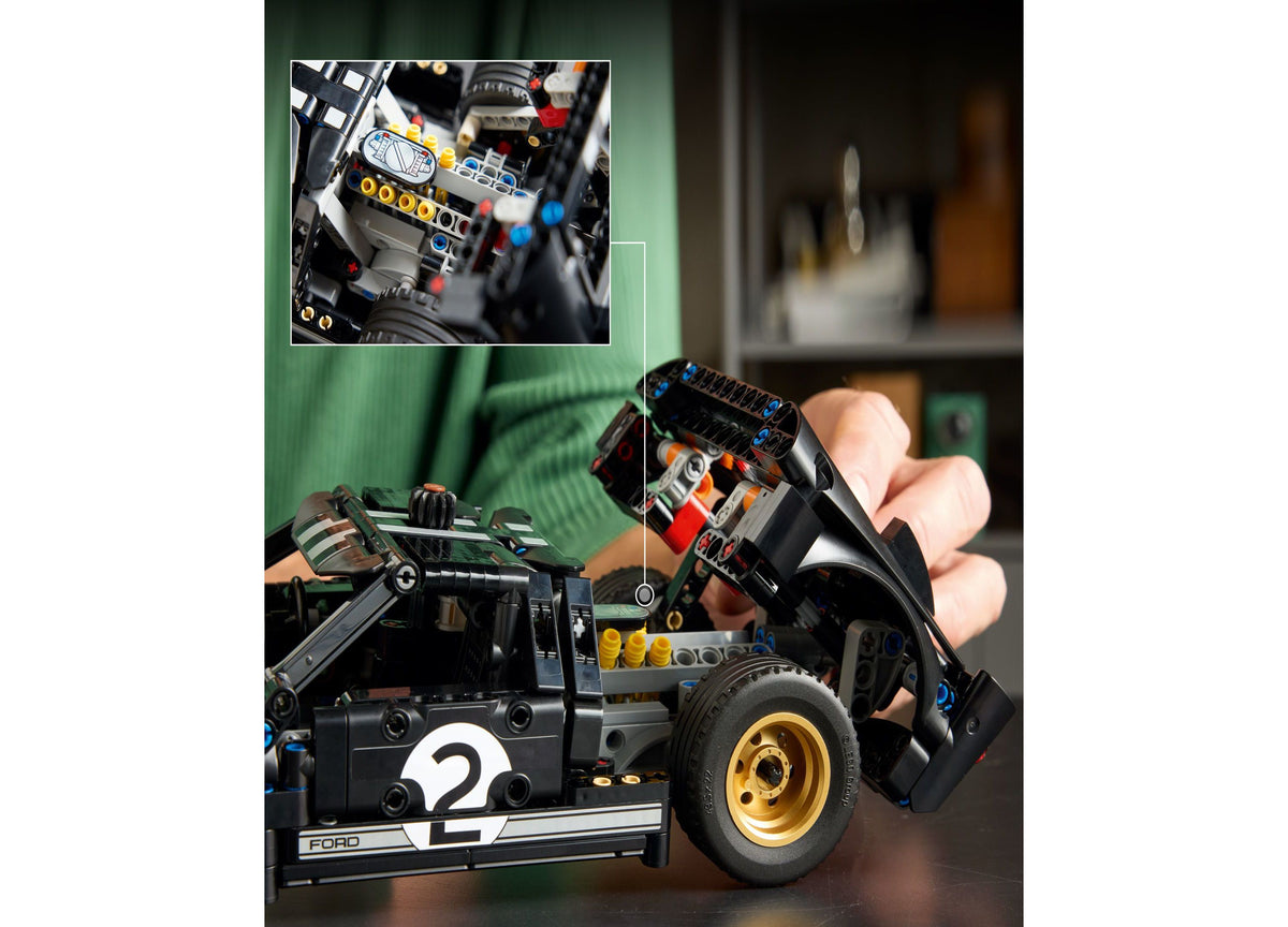 LEGO Technic 1966 Ford GT40 MKII Race Car Building Set with 793 pieces, shown assembled in black with gold wheels and...