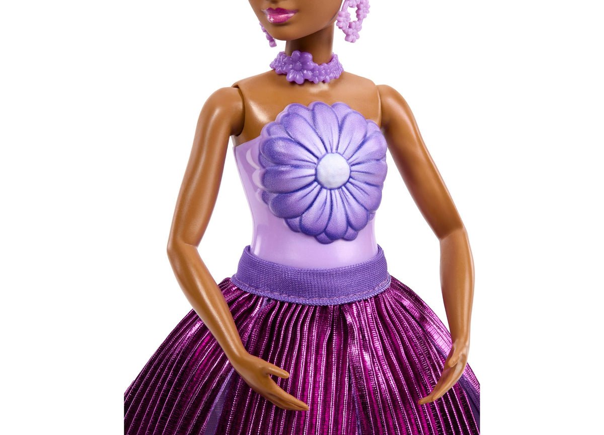 Barbie Petal Pop Scented Fashion Doll wearing purple flower bodice top and petal skirt with matching accessories