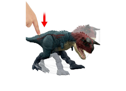 Jurassic World Charge N Chomp Carnotaurus dinosaur toy with roaring mouth and red horns