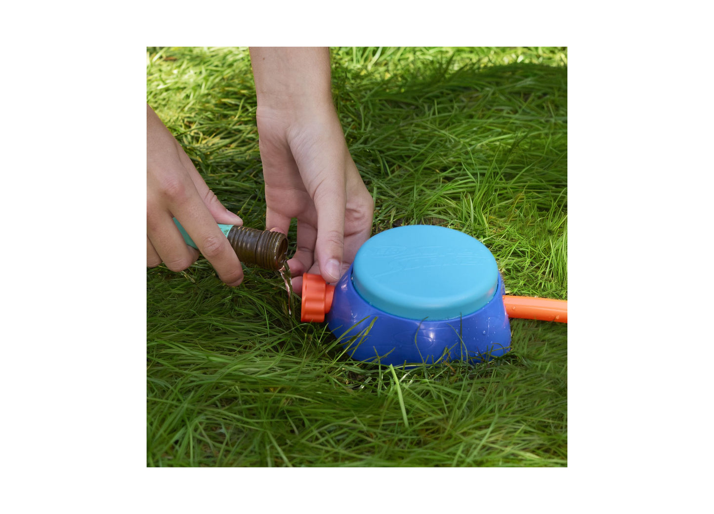 Nerf Super Soaker Stomp and Soak water toy in blue and orange being used on grass