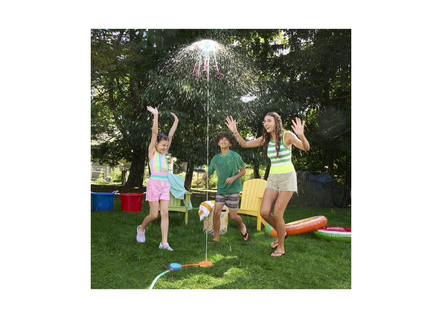 Nerf Super Soaker Stomp and Soak water toy in use during outdoor backyard water play with children