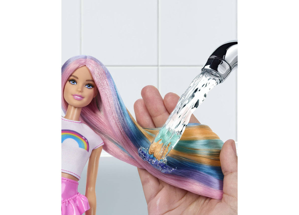 Barbie Rainbow Sparkle Hair Fashion Doll with pink, blue, and gold hair being styled with sparkle comb