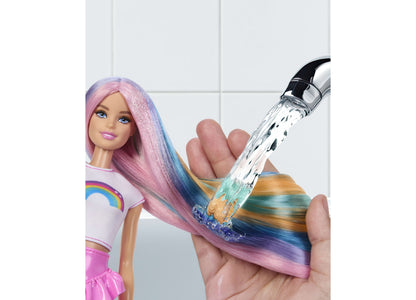 Barbie Rainbow Sparkle Hair Fashion Doll with pink, blue, and gold hair being styled with sparkle comb