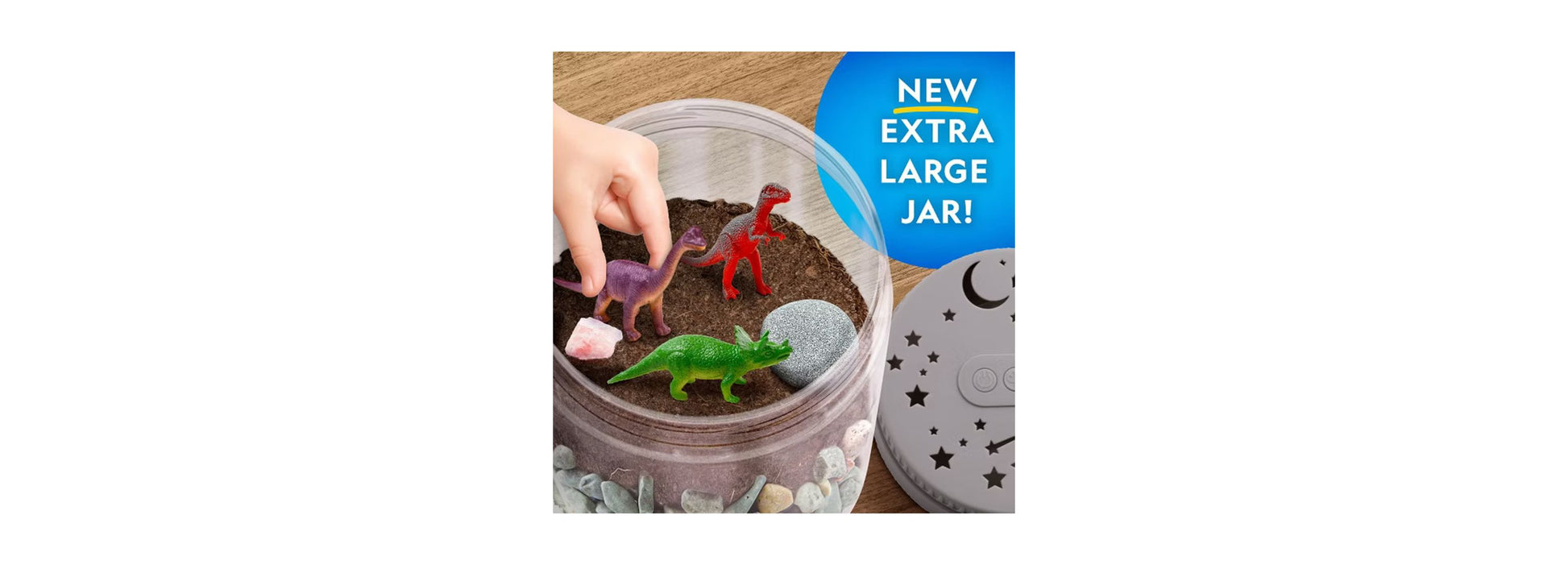 National Geographic Light-Up Dinosaur Terrarium Kit with colorful dinosaur figures in sand and rocks