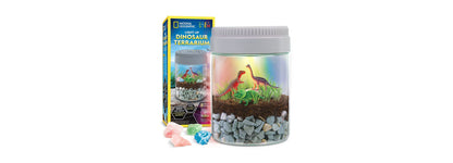 National Geographic Light-Up Dinosaur Terrarium Kit with illuminated jar, dinosaur figurines, and colored crystals