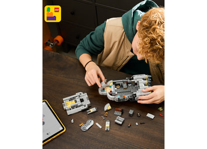 LEGO Star Wars Mandalorian Starship 75445 building set with 701 pieces being assembled by child
