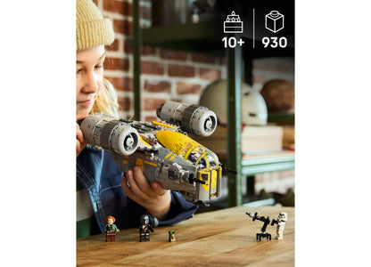 Child holding LEGO Star Wars The Razor Crest 75447 yellow and gray starship building set with minifigures