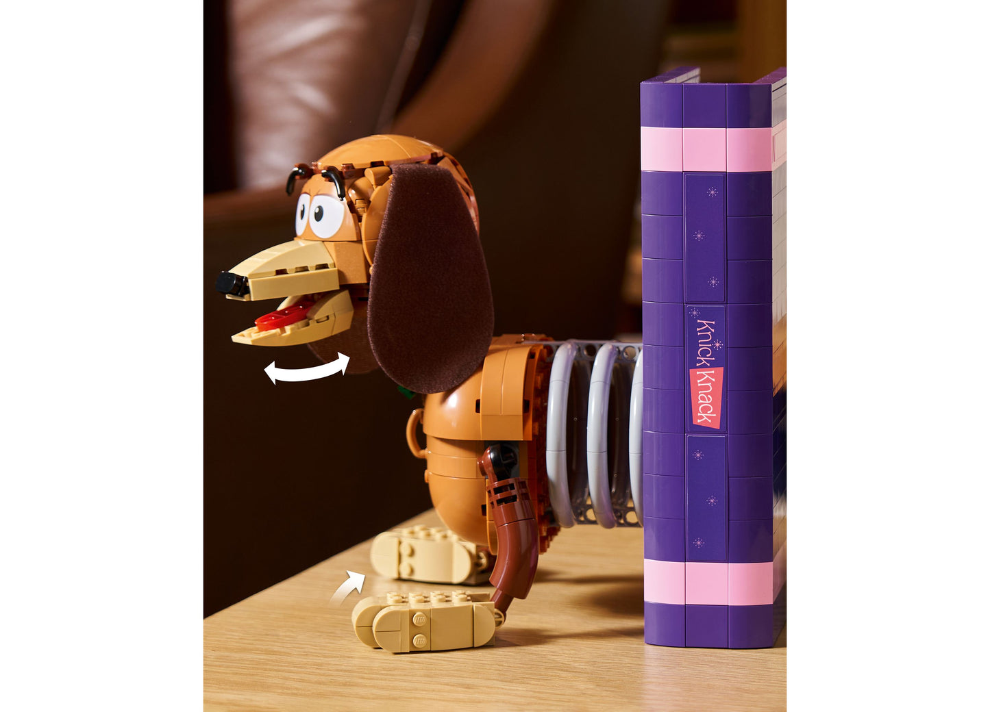 LEGO Disney Pixar Toy Story Slinky Dog Bookends set with orange and brown dog figure next to purple box