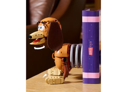 LEGO Disney Pixar Toy Story Slinky Dog Bookends set with orange and brown dog figure next to purple box