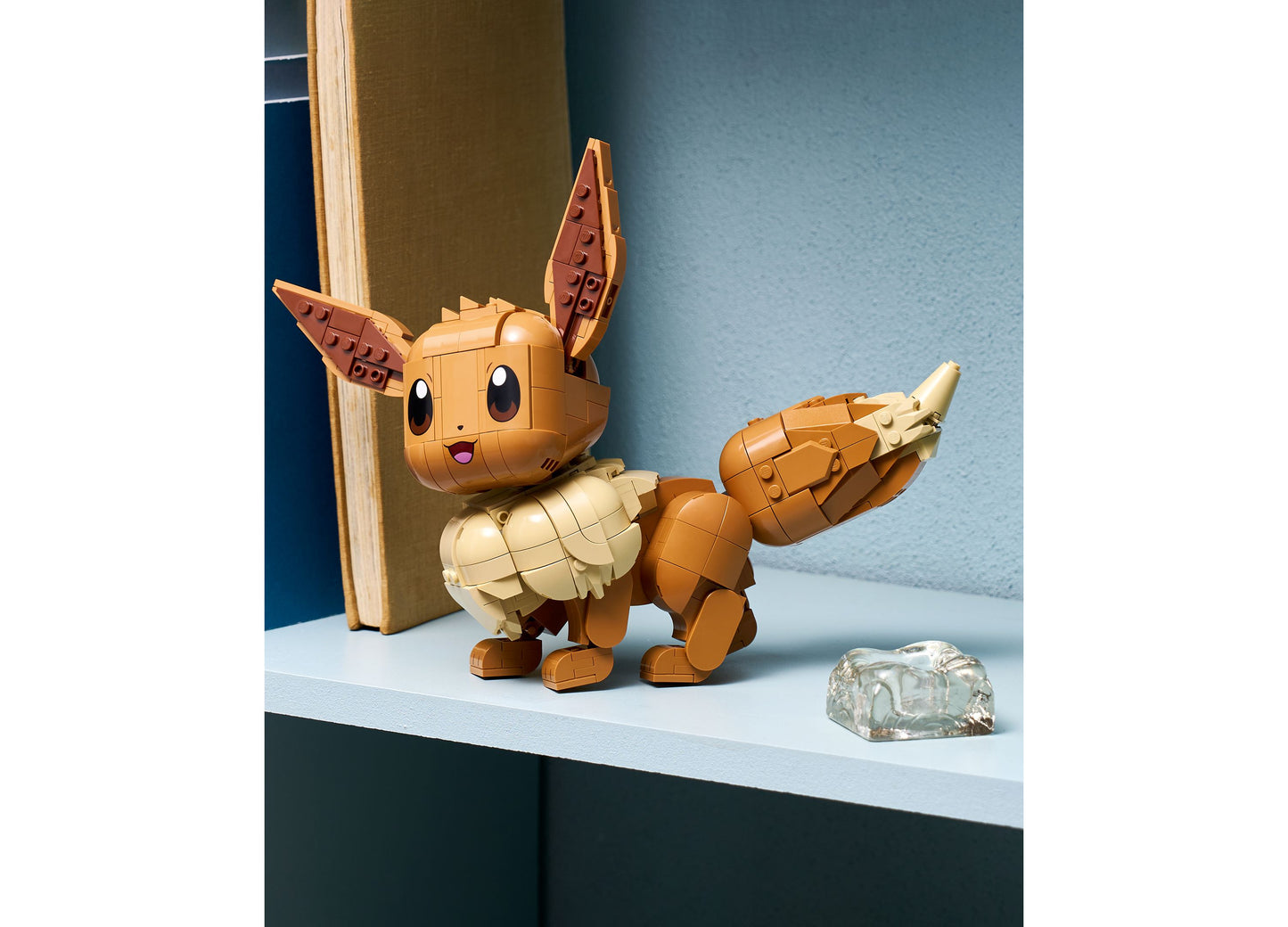 LEGO Pokémon Eevee Building Set 72151 brown and cream posable figure with articulated ears and limbs displayed on shelf