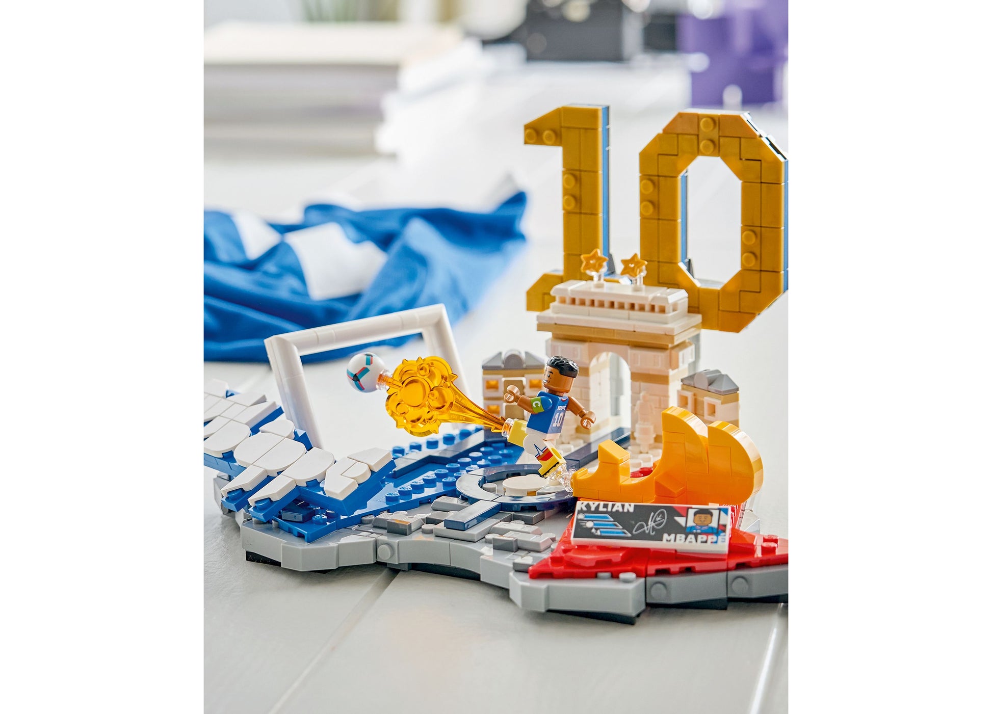 LEGO Kylian Mbappé Soccer Highlights 43013 set with blue and gold soccer player figure and stadium pieces