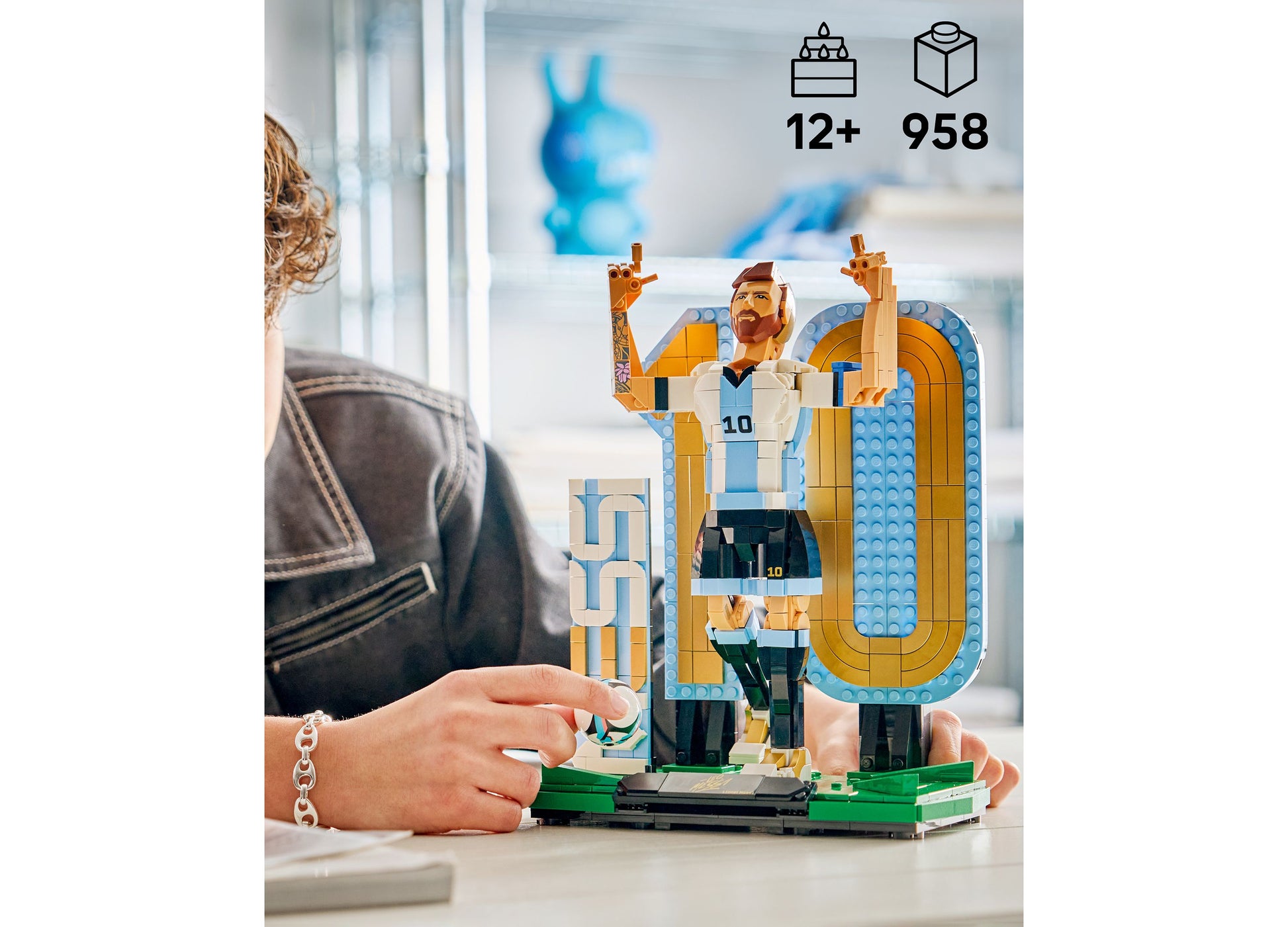 LEGO Lionel Messi Soccer Legend 43015 set with 958 pieces featuring blue and gold stadium architecture