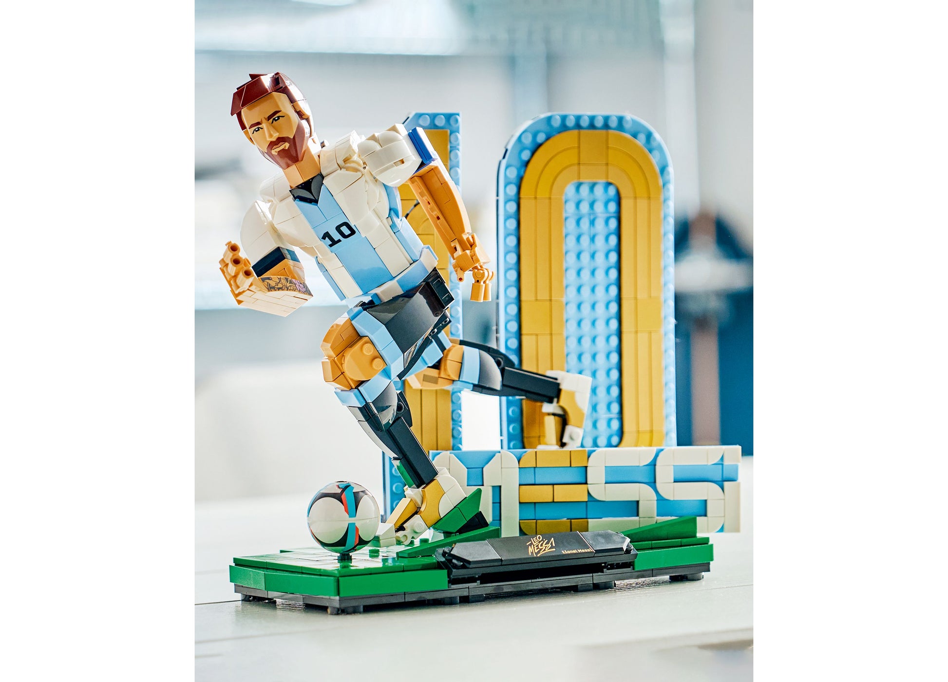 LEGO Lionel Messi Soccer Legend 43015 buildable figure in blue and white jersey with soccer ball and stadium backdrop