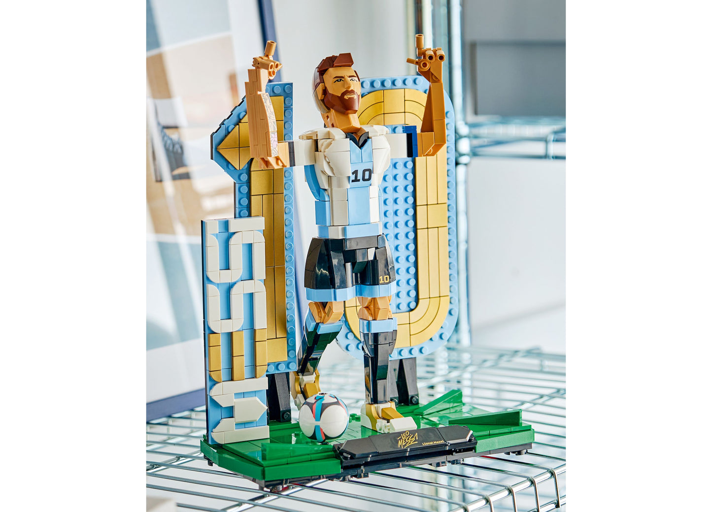LEGO Lionel Messi Soccer Legend 43015 minifigure with blue and white jersey on podium with trophy
