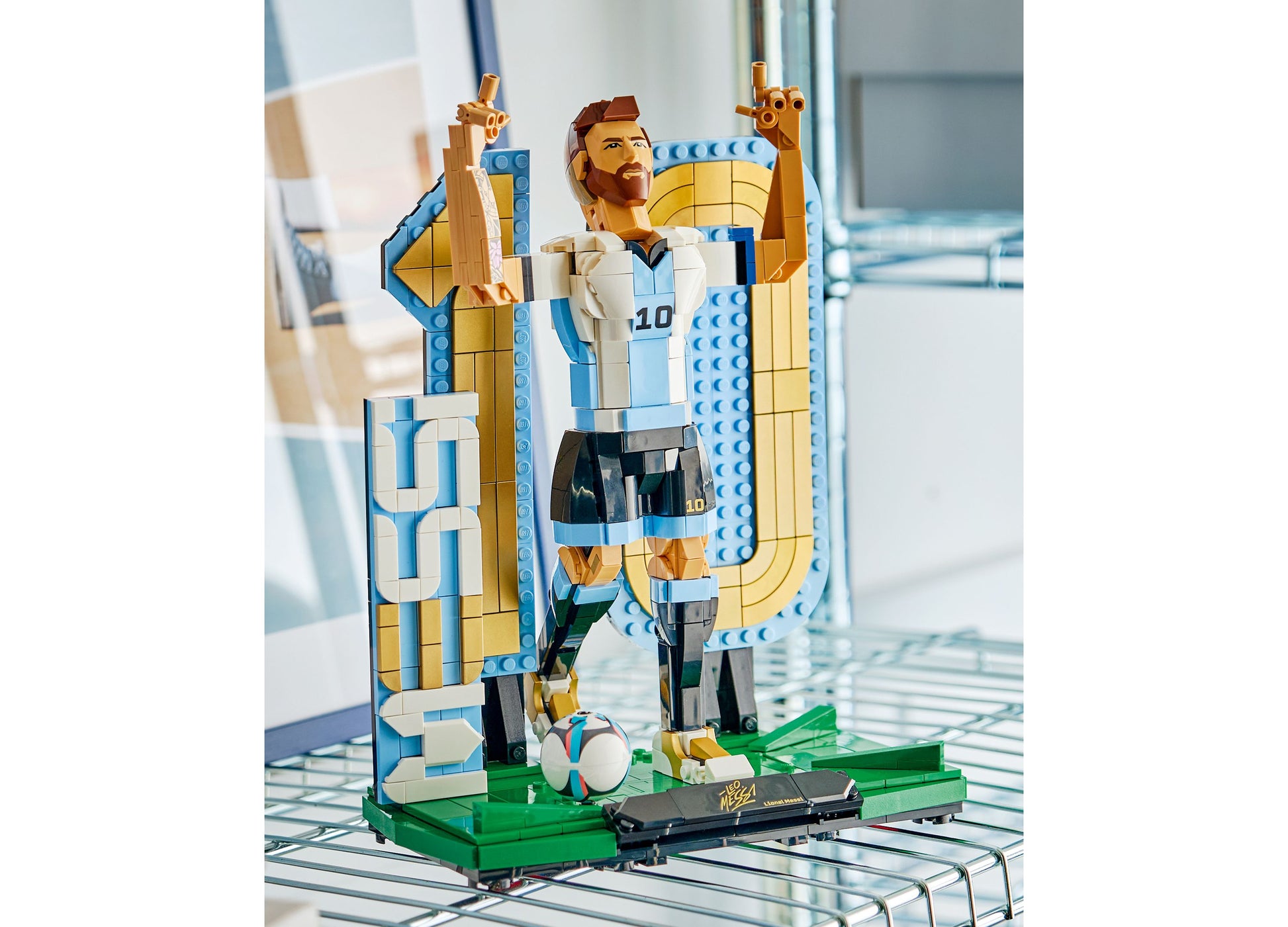 LEGO Lionel Messi Soccer Legend 43015 minifigure with blue and white jersey on podium with trophy