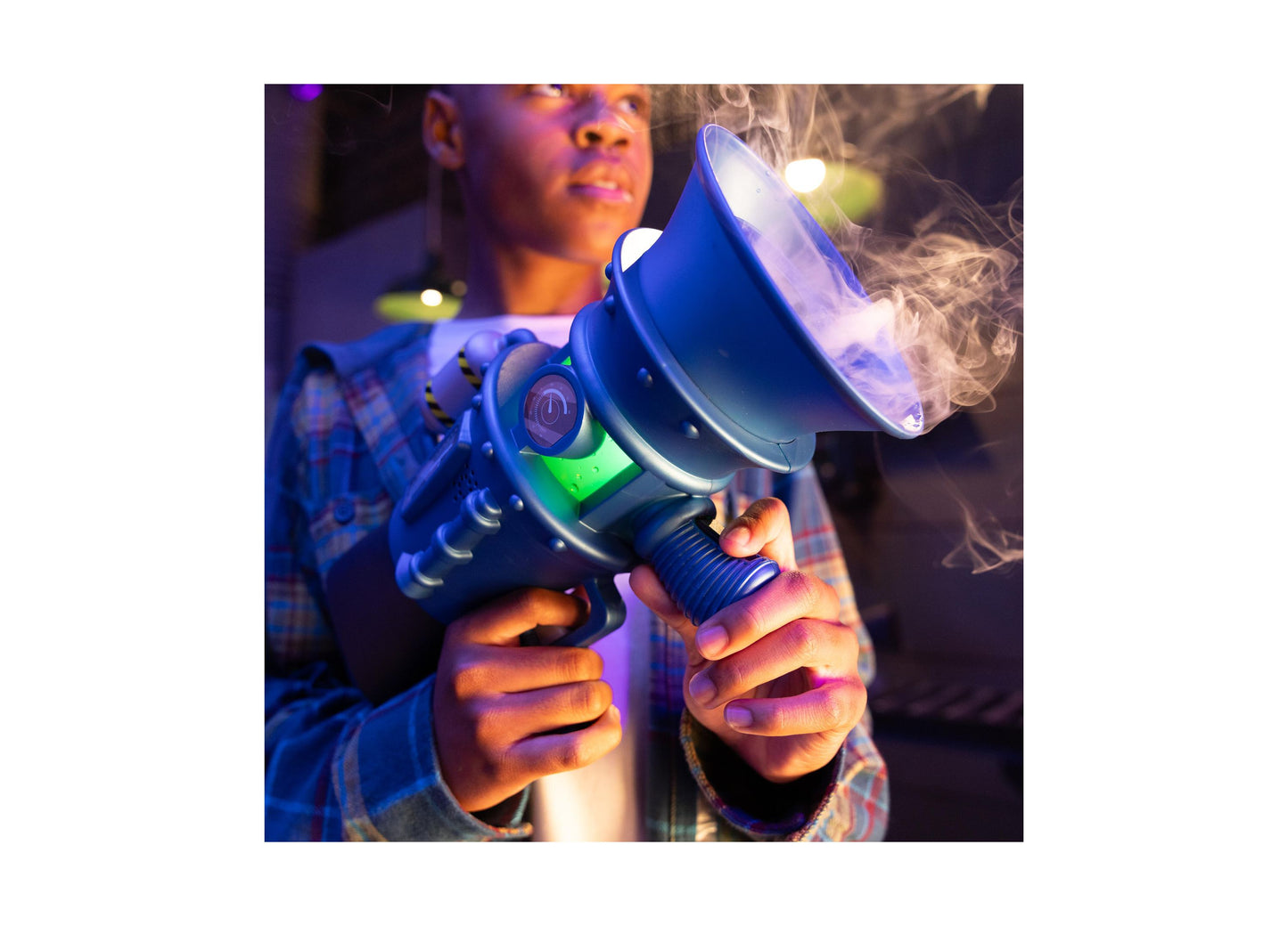 Child holding Despicable Me Minions 3 Supreme Fart Blaster toy with blue and green design emitting fog effect