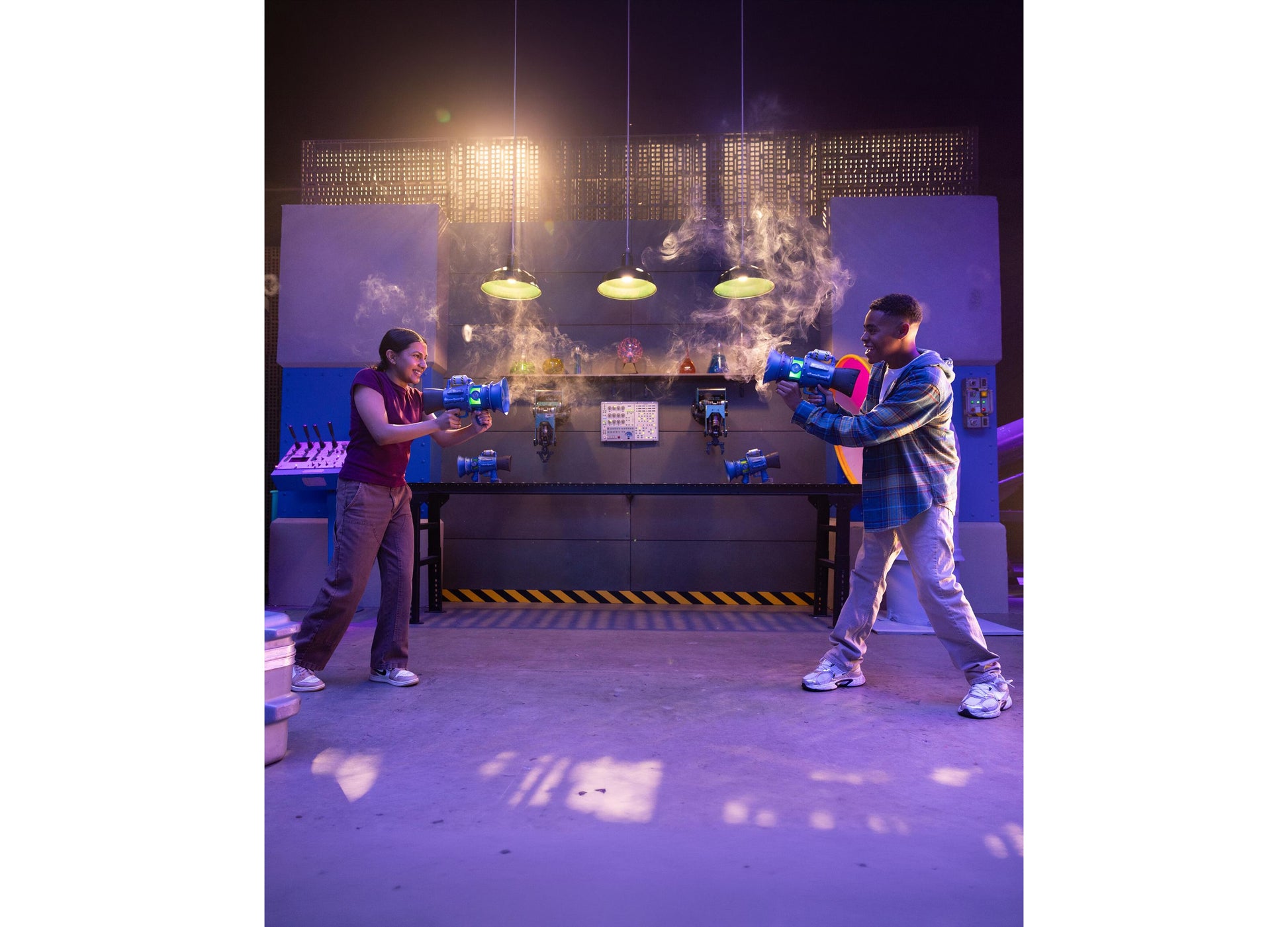 Despicable Me Minions 3 Supreme Fart Blaster toy guns in blue, held by two children in interactive play