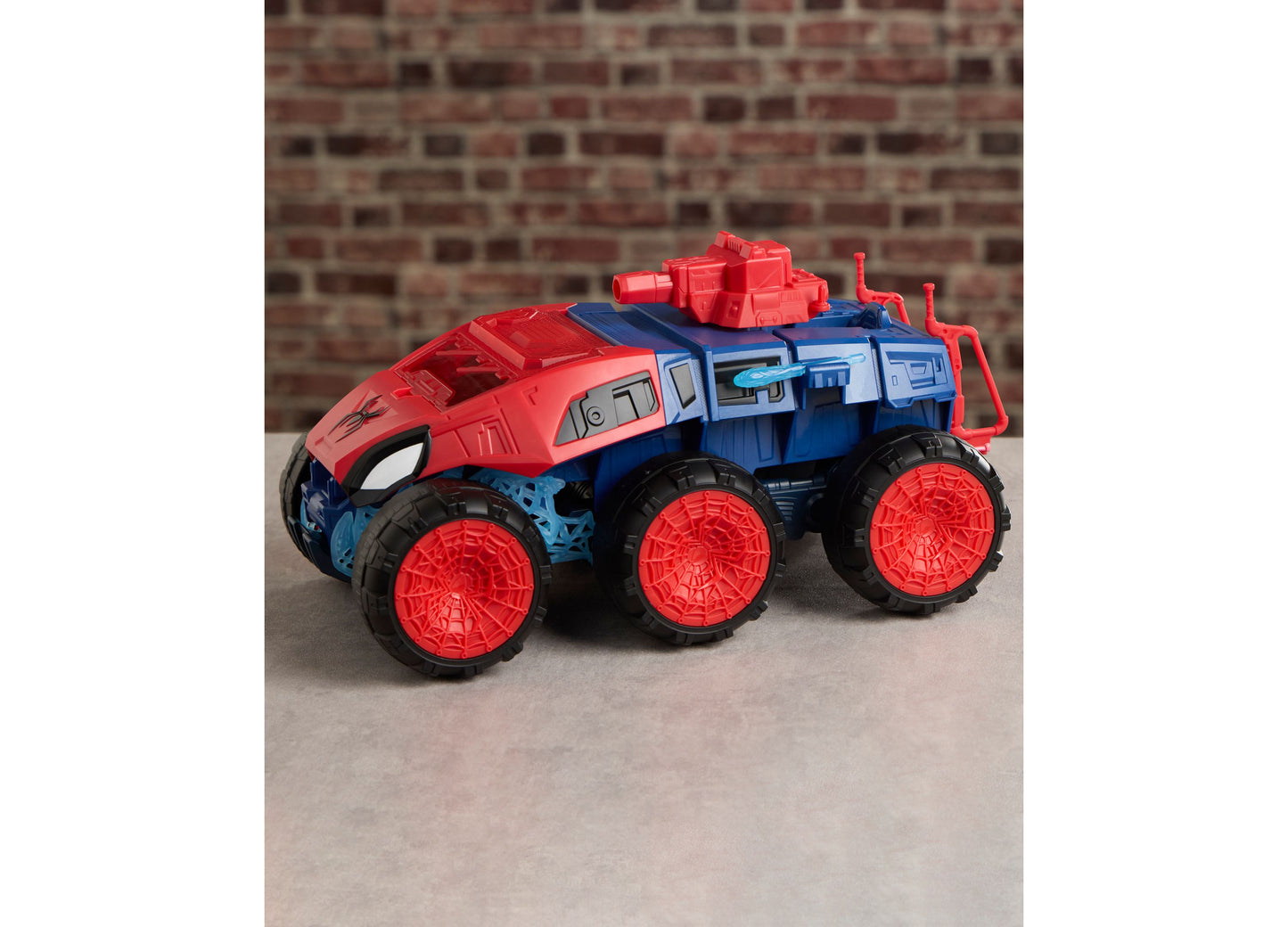 Spider-Man 2-In-1 Super Chompin Tank toy with red and blue colors and large red wheels