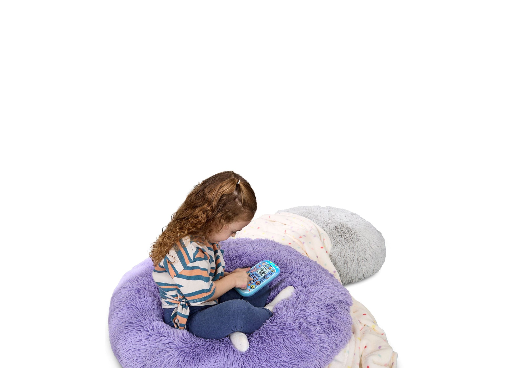 Child playing with VTech Stitch Learning Phone on purple plush seat