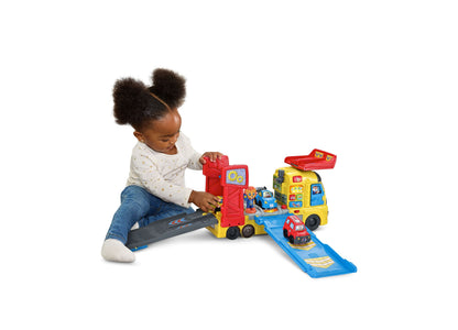VTech 3-in-1 Race & Repair Hauler yellow and red interactive toy vehicle playset with toddler playing