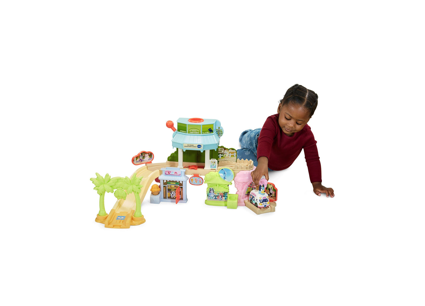 Bluey Ice Cream Adventure Playset with interactive ice cream truck, palm trees, and colorful buildings for toddlers
