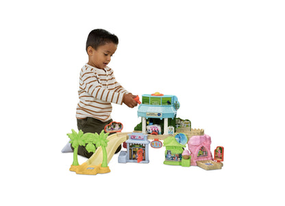 Bluey Ice Cream Adventure Playset with interactive ice cream truck, palm trees, and colorful buildings for toddlers
