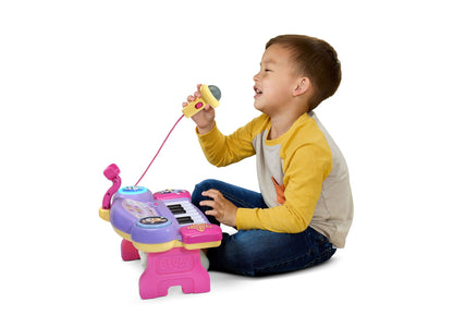 Bluey Sing-Along Keyboard toy in pink and purple with child playing microphone