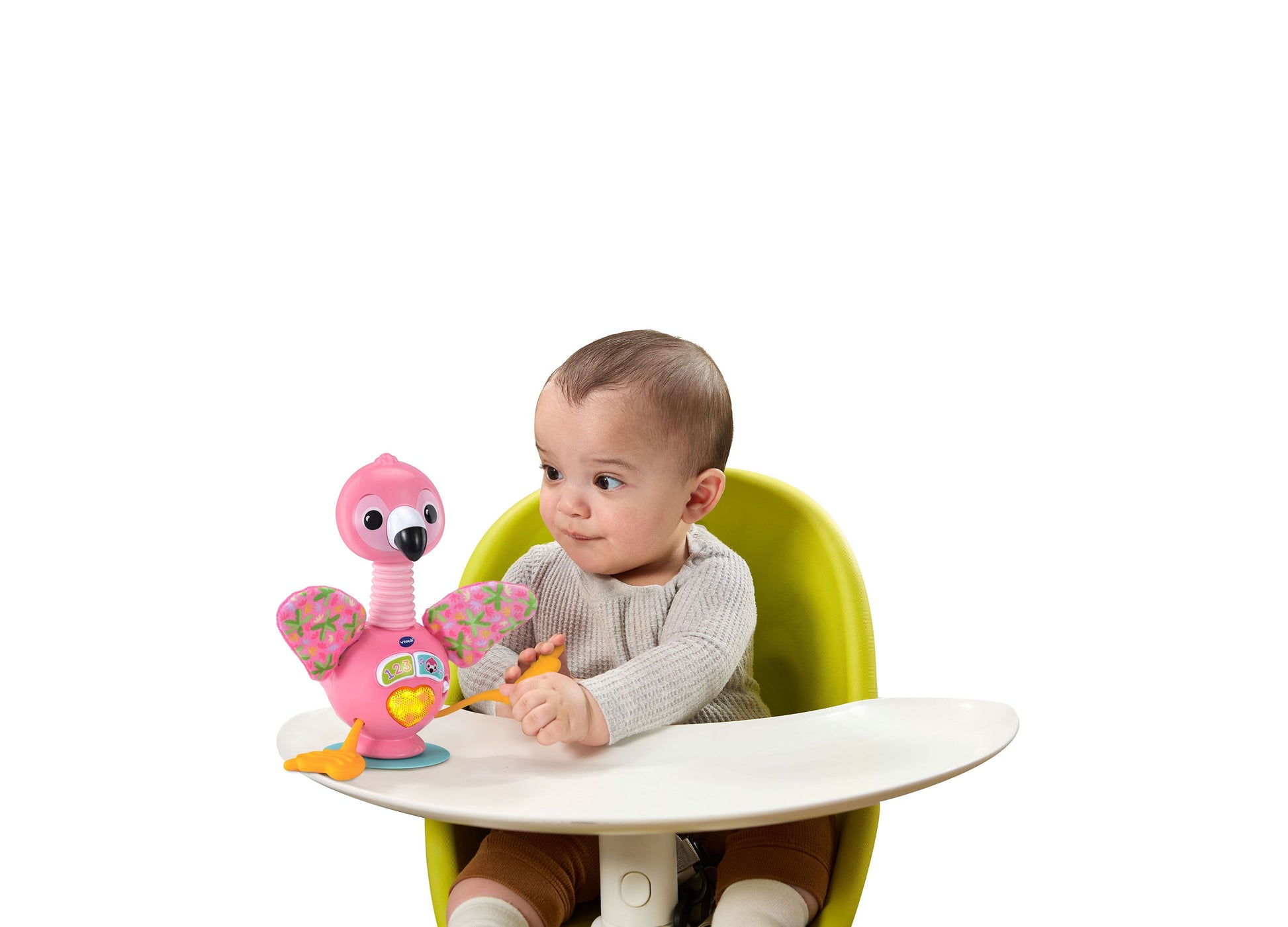 VTech Baby Bounce & Bobble Flamingo pink toy with colorful wings, baby playing with toy at table