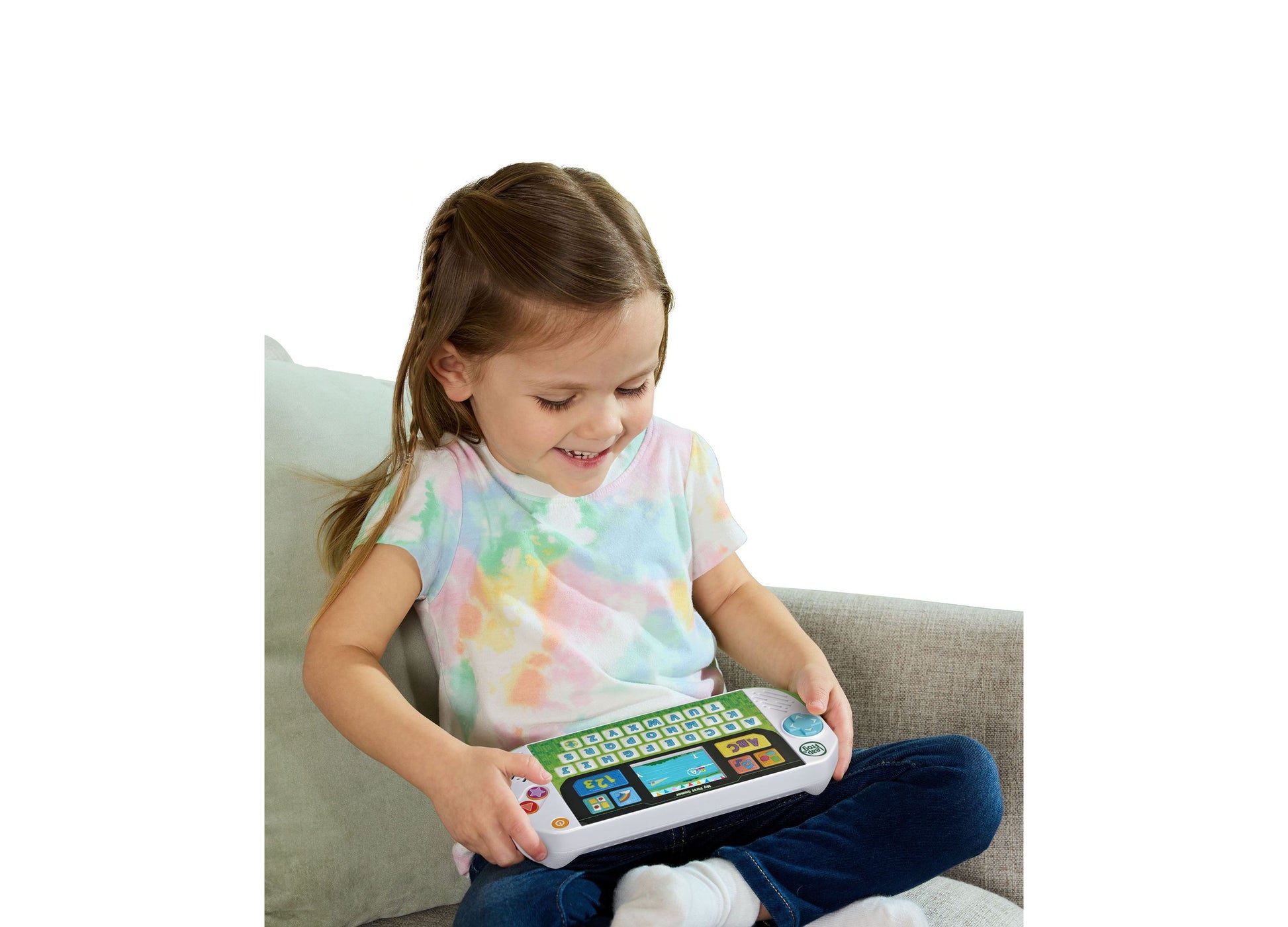 LeapFrog My First Gamer toy with colorful keyboard and screen, held by smiling child
