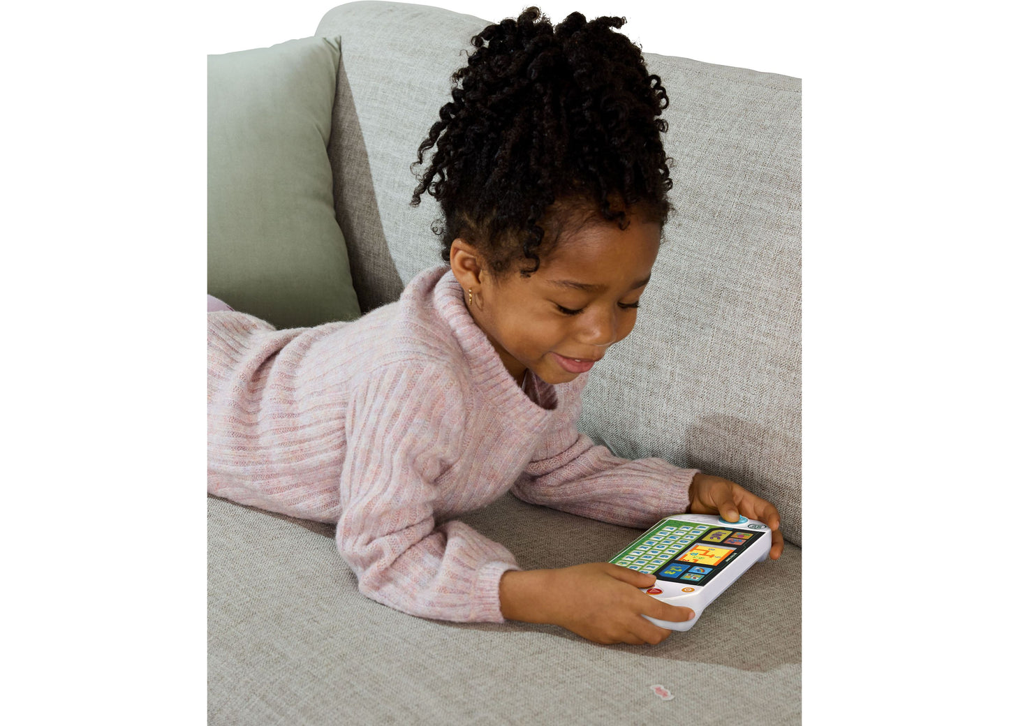 LeapFrog My First Gamer toy with colorful game buttons held by child on couch