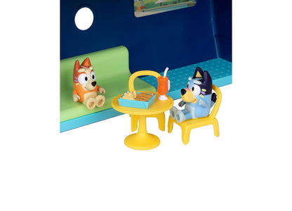 Bluey Cruise Ship playset with yellow table and chair, orange and blue character figures, and accessories