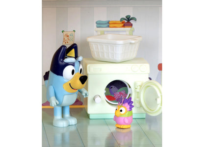 Bluey Lights & Sounds House Playset with blue dog character, washing machine, laundry basket, and colorful accessories