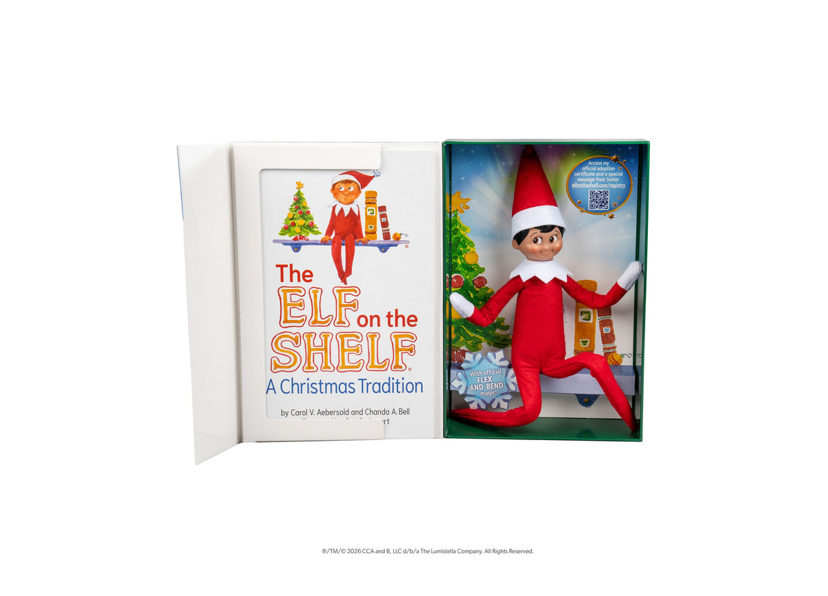 Elf on the Shelf Scout Elf Boy figure with red suit and hat next to storybook in boxed set
