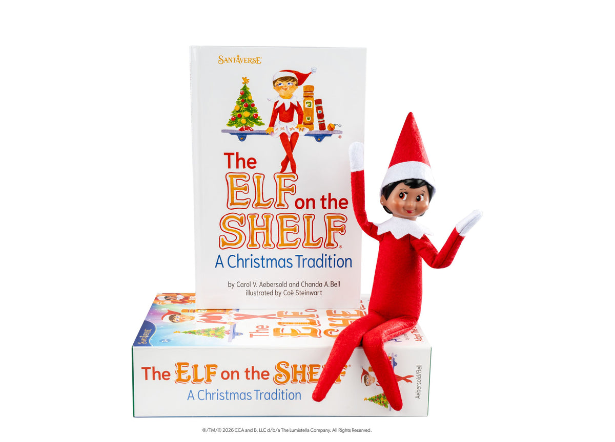 Elf on the Shelf Scout Elf Girl figure with red suit and hat next to storybook and boxed set