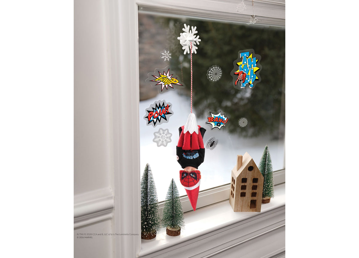 Elf on the Shelf Marvel Spider-Man 4-Piece Superfan Set displayed in window with red and black Spider-Man outfit, can...