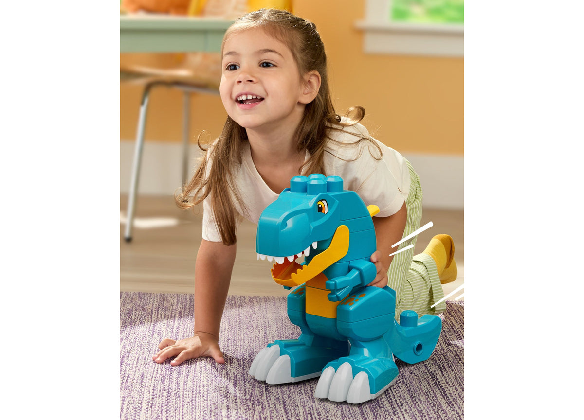 Mega Bloks Fisher-Price Build & Chomp Dinosaur set with turquoise and yellow T-Rex figure with rolling wheels