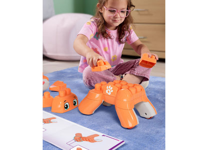 Child building orange Mega Bloks Fisher-Price Rolling Kitten 3-in-1 set with instruction card