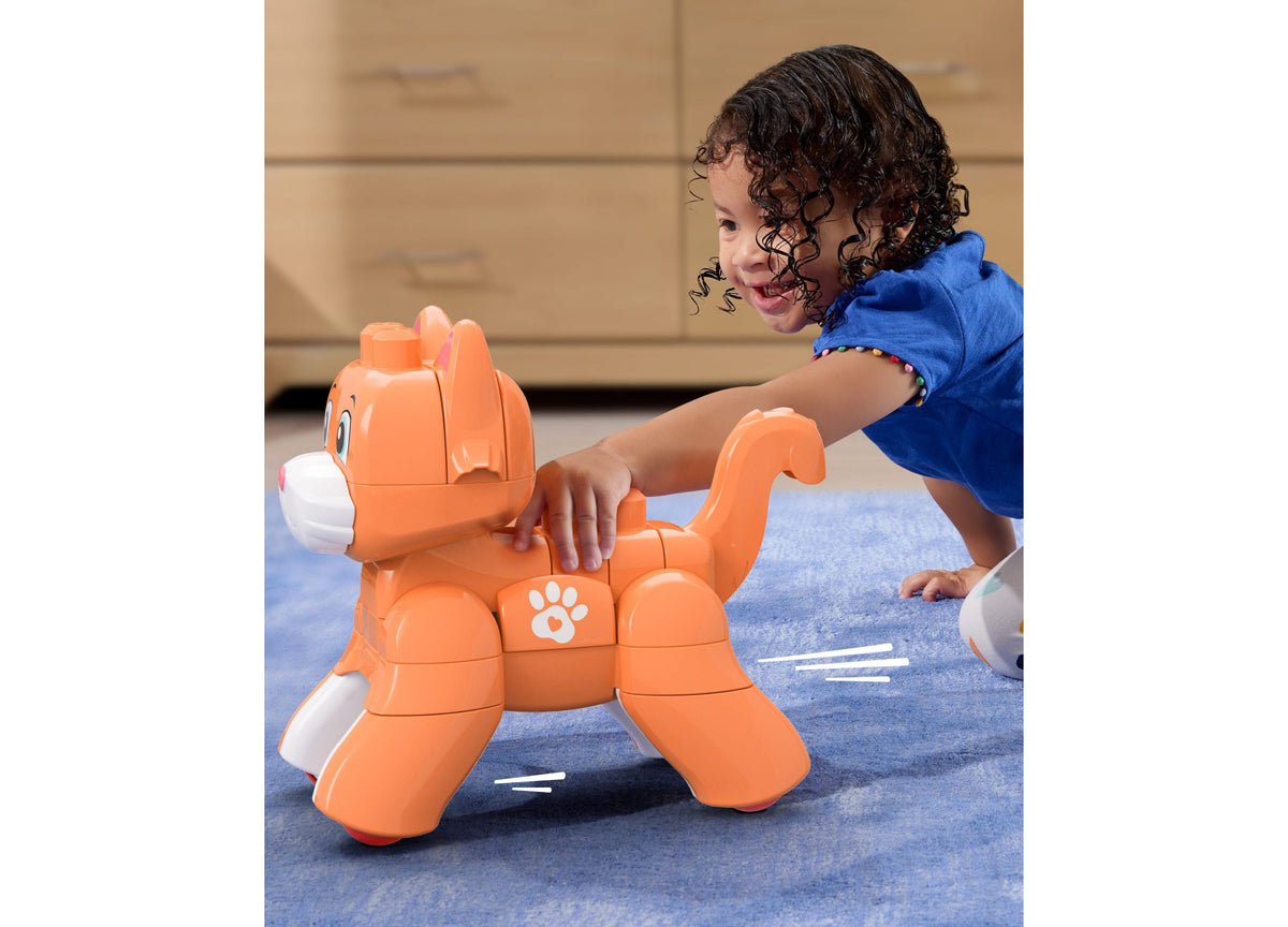 Orange Mega Bloks Fisher-Price Rolling Kitten 3-in-1 building set with child playing
