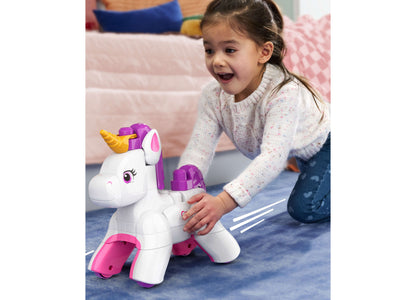 Mega Bloks Build & Enchant Unicorn 26-Piece Building Set in white, purple, and pink with a child playing