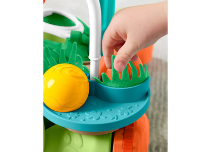 Fisher Price Turtle Walker with yellow ball and green grass feature, teal and orange colors