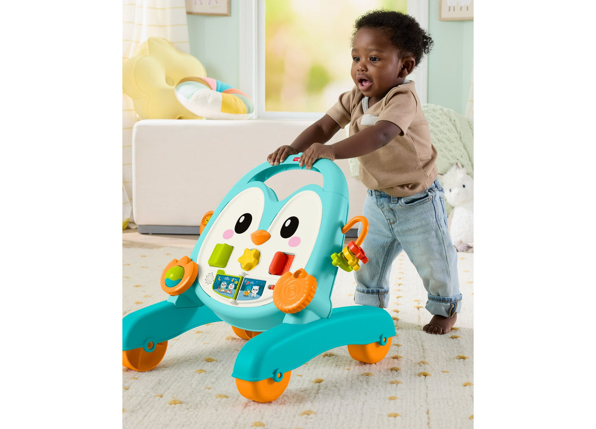 Fisher-Price 2-in-1 Musical Penguin Activity Walker in turquoise and orange with toddler playing