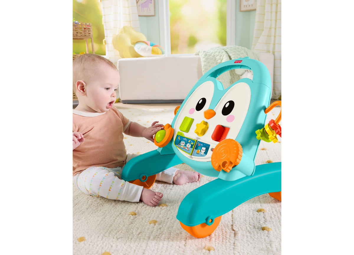 Fisher-Price 2-in-1 Musical Penguin Activity Walker in turquoise and orange with baby playing with colorful interacti...