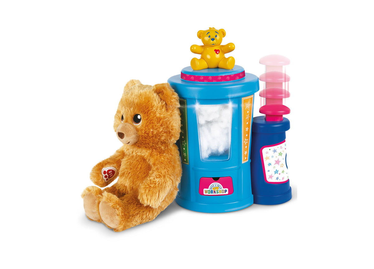 Casdon Build-A-Bear Workshop Stuffing Station playset with tan bear, blue machine, and pink dispenser