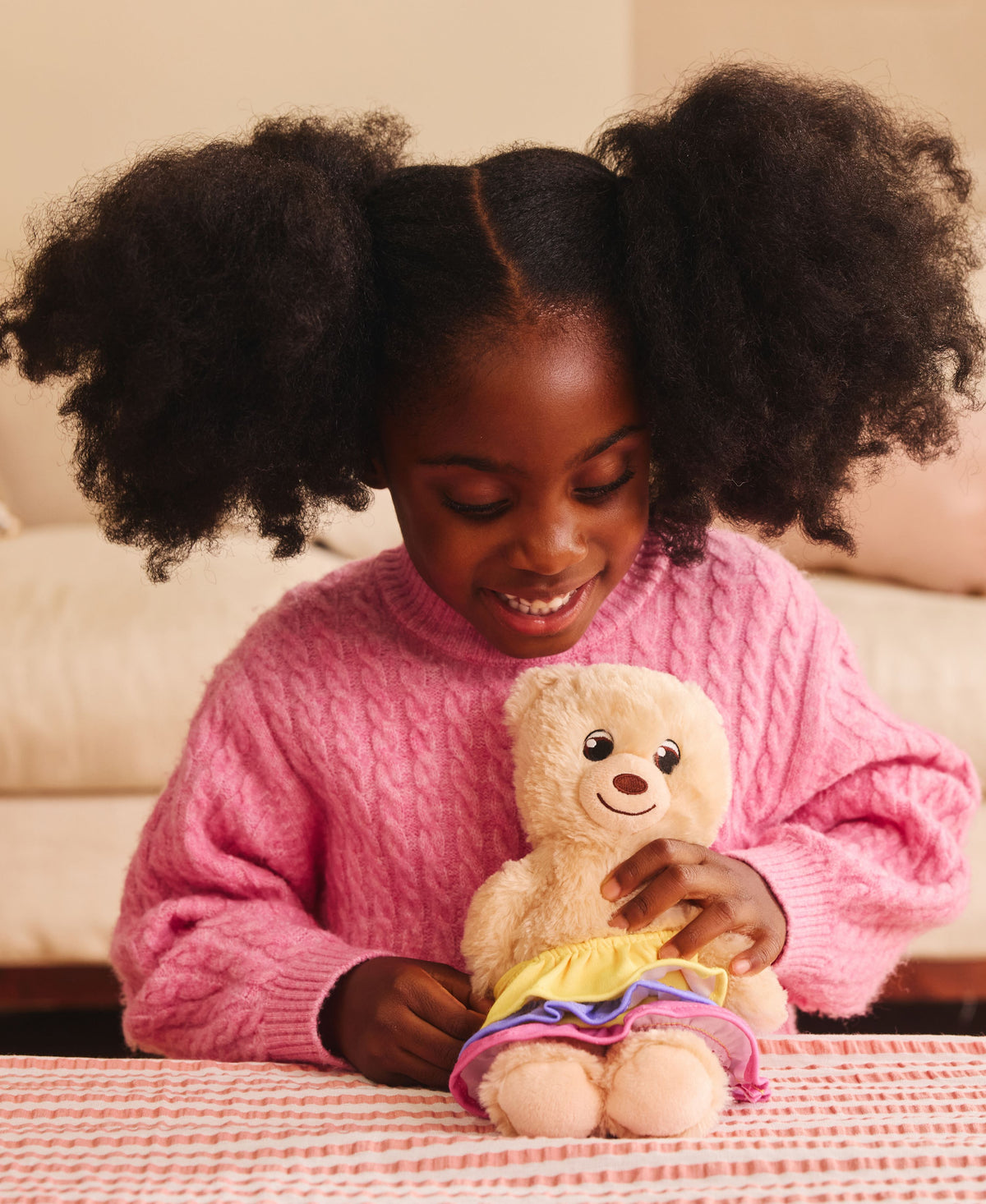 Casdon Build-A-Bear Workshop 2-Piece Stuffing Station with cream bear wearing colorful outfit