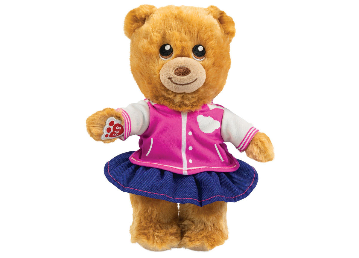 Casdon Bear Furtastic Friend plush bear wearing pink jacket and blue skirt with white heart detail