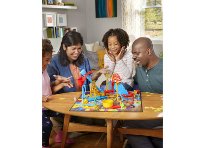 Mouse Trap 2-4 Player Board Game with colorful blue and red trap structure, yellow pieces, and family playing together