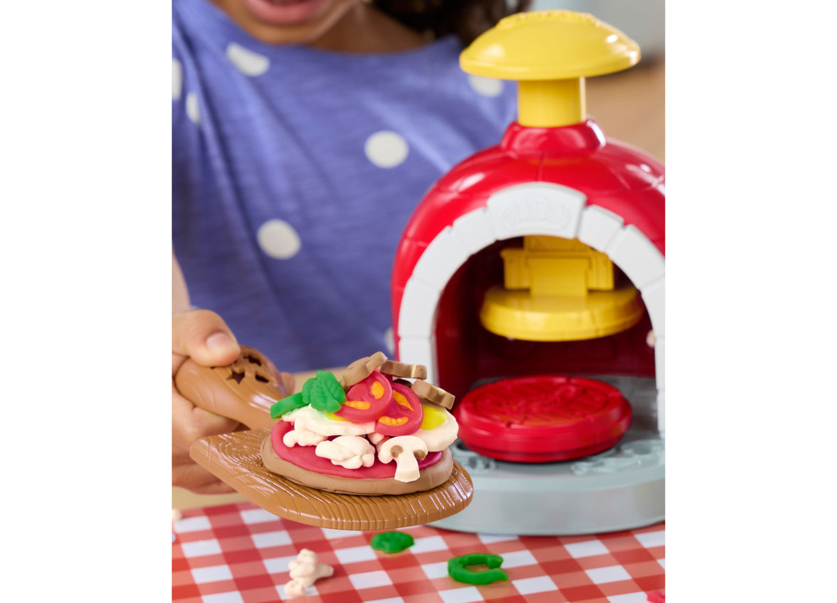 Play-Doh Stamp and Spin Pizza Playset with red oven, yellow roof, and colorful pizza toppings